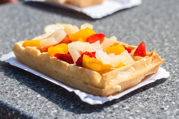 Waffle with fruits on the top.