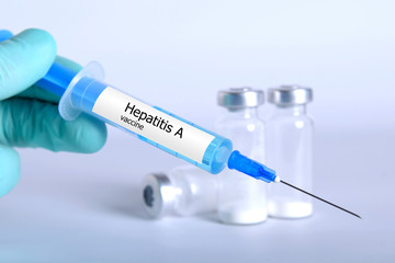 Vaccination healthcare concept. Hands of doctor or nurse in medical gloves with medical syringe...
