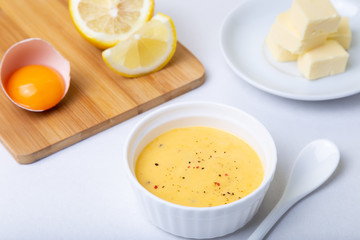 Homemade Hollandaise Sauce. Classic traditional sauce based on eggs. Basic sauce of French cuisine. Selective focus, close-up.