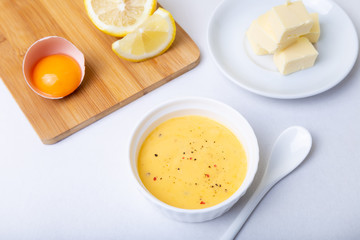 Homemade Hollandaise Sauce. Classic traditional sauce based on eggs. Basic sauce of French cuisine. Selective focus, close-up.
