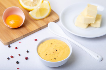 Homemade Hollandaise Sauce. Classic traditional sauce based on eggs. Basic sauce of French cuisine. Selective focus, close-up.