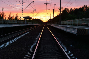 Fototapeta na wymiar railway track, sunset as background