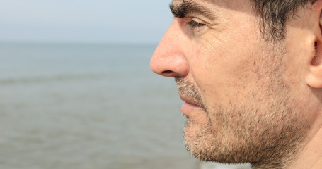 Obraz premium Very close profile of unshaven man