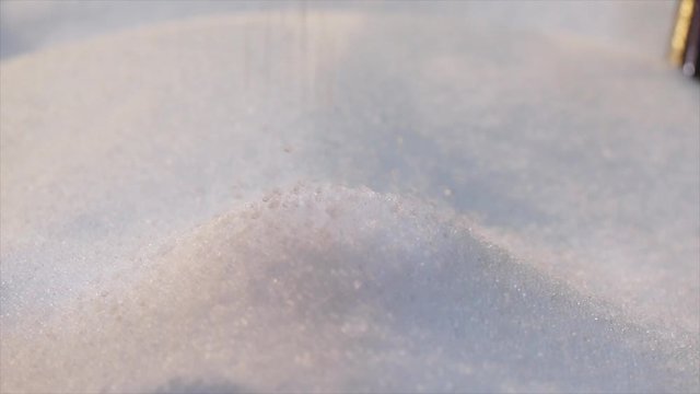 Polypropylene granules fall in slow motion. Polypropylene granular raw materials