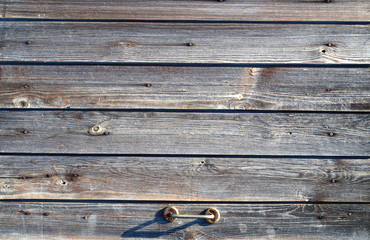 Old doors knocked down from dark boards