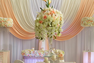 Festive table decoration with flowers at a wedding exhibition