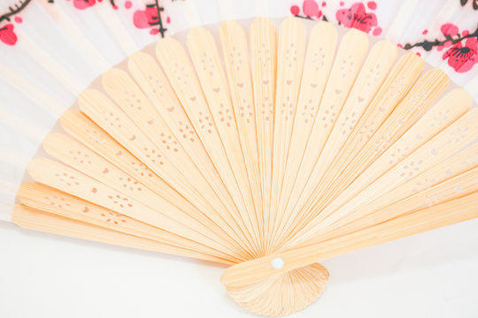 Wooden fan and almond flowers - Image