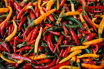 a colorful mix of the freshest and hottest chili peppers. Background
