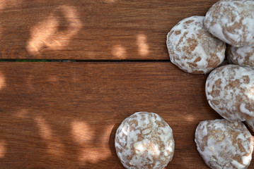Heap of honey-cake on wooden table. Russian spice-cakes with frosting with copy space for your text, top view.