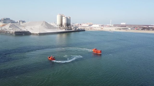 Test run a fast rescue craft and a life boat before being installed on the drilling rig