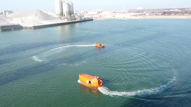Test run a fast rescue craft and a life boat before being installed on the drilling rig