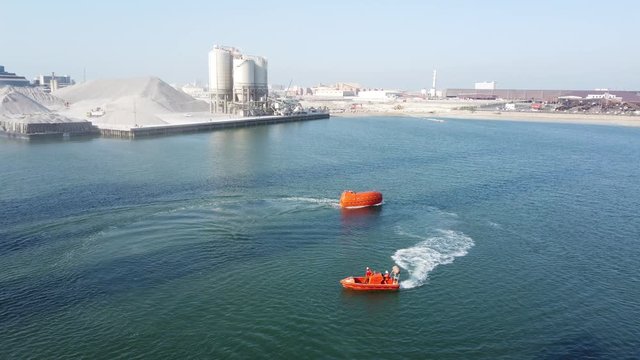 Test run a fast rescue craft and a life boat before being installed on the drilling rig