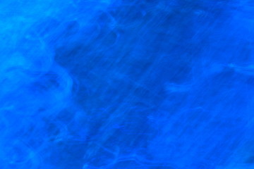 Fototapeta na wymiar Blue abstract blurry textured background