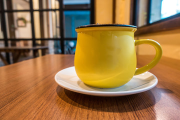 coffee latte art on the wood desk in coffee shop cafe