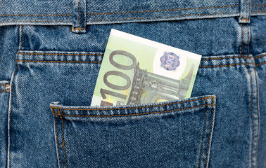 Euro banknotes in jeans back pocket. Forgotten money, nest egg. Concept of saving or spending...