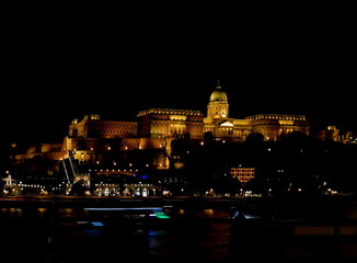 Buda Castle by the Danube river at night in Budapest, Hungary