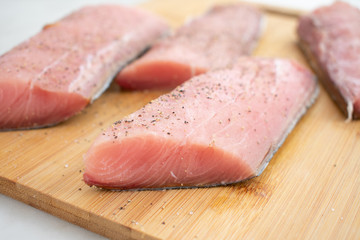 Raw Mahi Mahi (Dolphin Fish) Fillets on a Cutting Board