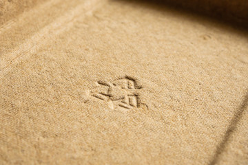 recycle sign on brown cardboard paper texture background