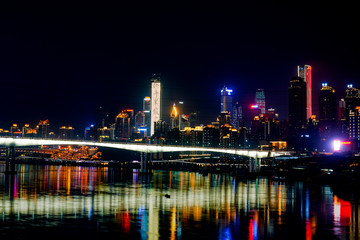 Fototapeta na wymiar Night Scenery of High-rise Buildings of Chongqing River-Crossing Bridge in Asia