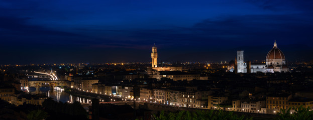 Florence by night - high resolution panorama of Florence, Tuscany, Italy at dusk with the city center and landmarks: Lungarno, cathedral and Palazzo Vecchio (medieval city hall). Over 10k pixel wide
