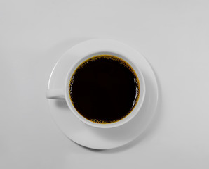 Black coffee in a white coffee cup on top view isolated on white background. Not clipping path