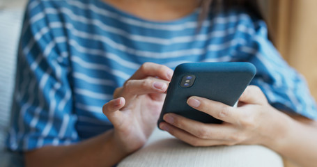 Woman use of cellphone at home