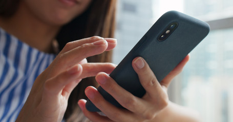 Woman check on smart phone at home