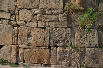 rough sandy texture of an old medieval stone wall. Background for design, close-up, copy space