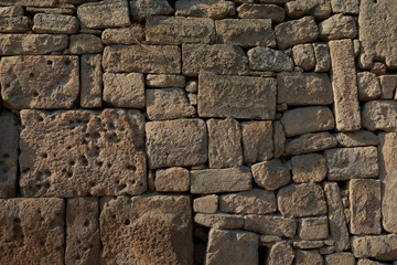 rough sandy texture of an old medieval stone wall. Background for design, close-up, copy space
