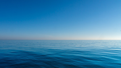 Relaxing/calming waves of the North Sea/Ocean taken during a warm sunny morning with a blue...