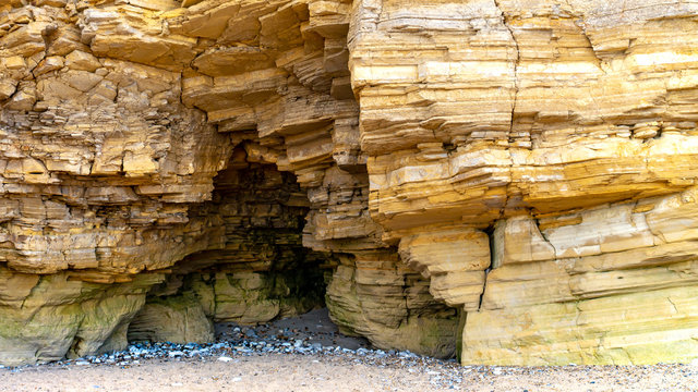 Limestone Rock, Cliff Face structure showing interesting, intricate stone structure and a natural cave that was used by smugglers, taken at Marsden Bay near The Leas in Sunderland.