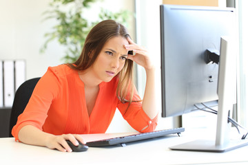 Worried entrepreneur checking computer content