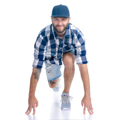 Man in jeans shorts, cap, casual clothing running smiling on white background isolation