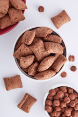 Breakfast cereals in a bowl viewed from above. Top view