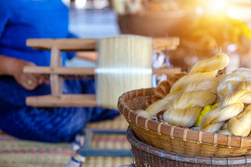 The golden thread from the silk Is a handicraft weaving work