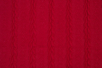 The fabric is a waffle knit red. The texture of the knitted fabric