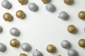 Composition with christmas balls on white background, space for text