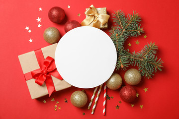 Composition with Christmas accessories on red background, empty space