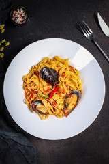 pasta with mussels (tagliatelle seafood) menu concept. food background. copy space. Top view