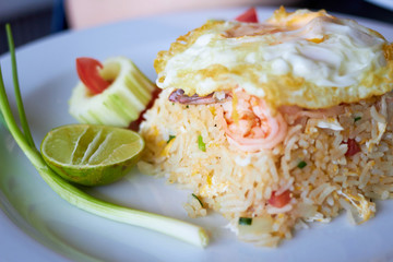 Seafood or prawn shrimp fried rice with lemon in plate,closed up