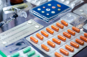 Close-up of different pills in a blister pack.