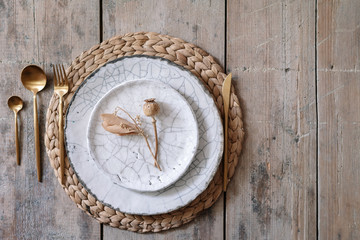 Table setting with plates, tableware and cutlery