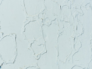 Abstract background, wall with damaged old paint, painted over white