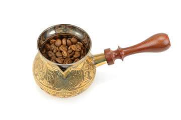 Coffeepot and beans isolated on white background.