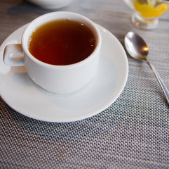 tea with lemon cafe white cup saucer