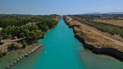 Aerial bird's eye view photo taken by drone of stand up paddle surfers in annual SUP crossing competition in Corinth Canal, Greece