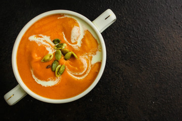 pumpkin or carrot cream soup (first course, healthy food, diet) menu concept. food background. copy space. Top view