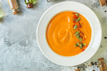 pumpkin or carrot cream soup (first course, healthy food, diet) menu concept. food background. copy space. Top view