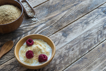 bran oat with yogurt in wooden background