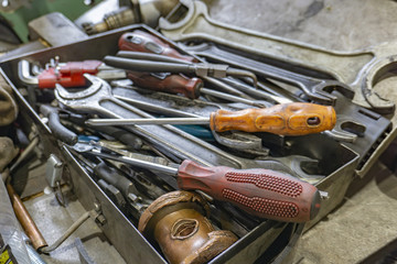 Fototapeta premium Locksmith box with keys, screwdrivers and a tool for equipment repair.